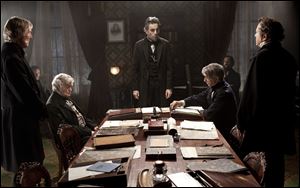Daniel Day-Lewis, center rear, as Abraham Lincoln, in a scene from the film, 