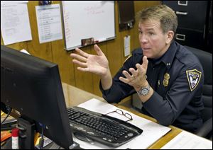 Steubenville police Chief William McCafferty sits behind a computer in his captains office as he tells how he gave the FBI an email that he had opened earlier which disabled his computer on Wednesday.