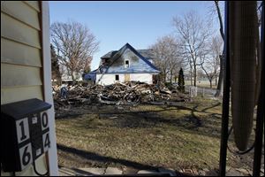 What remains of the three homes that were destroyed by fire on Fernwood Avenue.