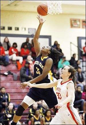 Notre Dame's Tierra Floyd, left, is fouled by Central Catholic's Michelle Murnen during the fourth quarter Thursday night.