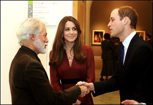The Duke and Duchess of Cambridge meet artist Paul Emsley after viewing the newly-commissioned portrait of The Duchess of Cambridge at the National Portrait Gallery in central London.