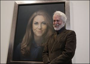 Artist Paul Emsley poses by his newly-unveiled first official portrait of Kate, Duchess of Cambridge, on display at the National Portrait Gallery in London.