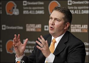 Rob Chudzinski answers questions at a news conference introducing him as the new head coach of the Cleveland Browns Friday in Berea, Ohio.