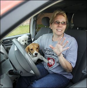 Teresa Hickman talks about guns in the Montpelier Exempted Village Schools as she waits in the parking lot to pick up her two sons and daughter. She called the district plan a protective stance.