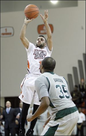 Bowling Green State University player Jordon Crawford, 1, hits a three point shot with 6.1 seconds left to give the Falcons a 46-44 victory over Eastern Michigan University.