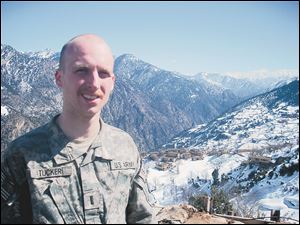 Kyle Tucker in the Afghan mountains above Combat Outpost Keating.