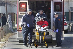 Safety personnel transport Trevon Gist, 21, who was shot in the foot in the Port Lawrence Homes public housing complex near downtown Toledo on Jan. 9. Mr. Gist is one of five people were have been shot in 2013.