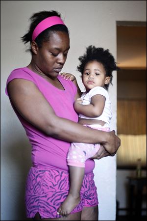 Sandra Felder, with her daughter Janiyah Henry, was hit Nov. 4, 2011, by a stray bullet that also struck her son Jashon in the abdomen.