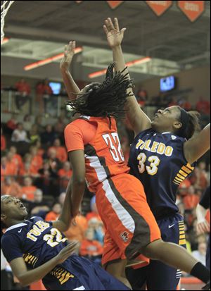 UT's Andola Dortch, left, takes one for the team as BGSU's Alexis Rogers is called for a foul late in the second half.