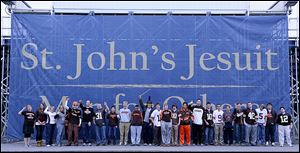 St. John's Jesuit students in Browns attire.