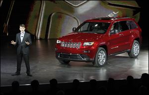 Jeep CEO Mike Manley unveils the 2014 Jeep Grand Cherokee equiped with a diesel engine at the North American International Auto Show in Detroit.
