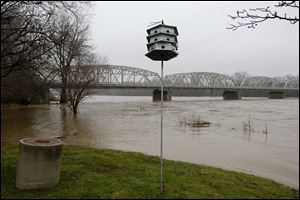 Portions of Memorial Park and the surrounding lowlands were submerged Sunday as the Maumee River crested its banks in Waterville. The National Weather Service has issued flood warnings.