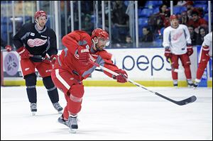 Detroit's Henrik Zetterberg takes a shot during a team practice in preparation for Saturday's season opener.
