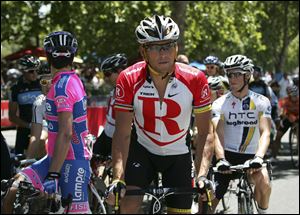 Lance Armstrong, center, was stripped of his Tour de France titles, lost most of his endorsements and was forced to leave Livestrong last year after the U.S. Anti-Doping Agency issued a damning, 1,000-page report that accused him of masterminding a long-running doping scheme. Monday he spoke to the Livestrong staff, saying, 