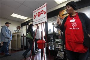 Volunteer Debra Vickers rings the bell for donations during The Salvation Army's annual Red Kettle Drive kickoff at Anderson's on Talmadge Road and Monroe Street this past November.