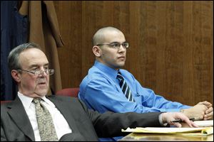 Attorney Jerry Phillips, left, in court with Aaron Nova, right,  the former Lucas County Dog Warden employee caught on videotape allegedly abusing a dog, in Toledo Municipal Court.