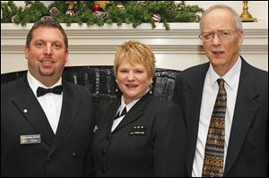 Bridge member Christopher Hoover, left, event chairperson and new commander Felicia Evans, center, and administrative officer John Mather, right, stand for a photograph during the Toledo Sail and Power Squadron's 75th Anniversary celebration at the Carranor Hunt and Polo Club in Perrysburg. The group was also celebrating the Change of Watch.