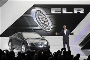 Mark Adams, executive director of Cadillac Global Design, introduces the ELR.  It can go 35 miles on battery power only. Using its 1.4-liter gas engine, it can cover more than 300 miles without refueling.