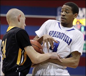 Springfield's Marquan Hodges (4) battles with Northview's John Wendt (34) for the ball during Tuesday's game. Hodges had seven points in the Blue Devils' win.