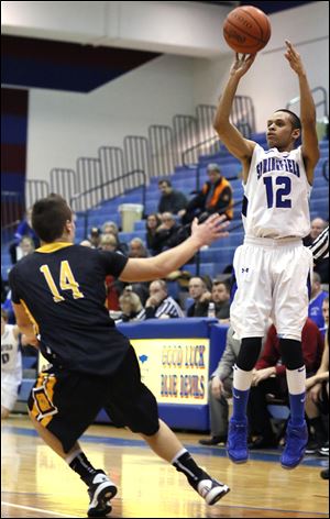 Springfield's Curtis Hassell goes up for 3 of his game-high 14 points.