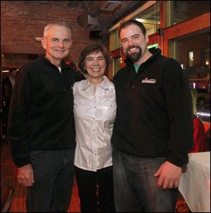 Owners Marty Lahey, left, Barbara Lahey, center, and Zach Lahey, right, celebrate 10th anniversary of their restaurant Manhattan's.