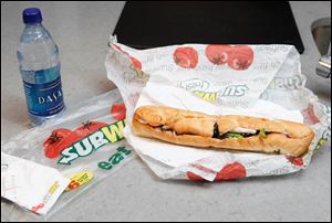 Subway, the world's largest fast food chain, is facing criticism after an Australian man posted a picture on the company's Facebook page of one of its famous sandwiches next to a tape measure that seems to shows it's not as long as promised. 