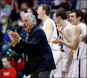 St. John's coach coach Ed Heintschel encourages his team en route to his 600th victory. He is now 600-189 in his career.