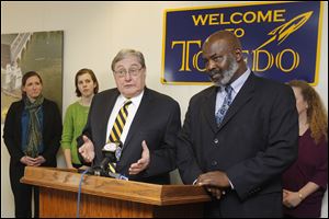 From left: Emily Avery, of United Way, Emily Hardcastle, with UT, UT President Dr. Lloyd Jacobs, Toledo Mayor Mike Bell and UT's Cindy Tierney attend a press conference at the mayor's office today to announce Monday's 
