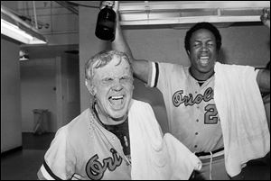 Baltimore Orioles manager Earl Weaver, left, is soaked with champagne after the Orioles defeated the California Angeles 8-0 to win the American League championship, in Anaheim, Calif.  