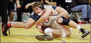 Rocco Caywood of Perrysburg, front, defeats Ryan Sill of Perry 9-6 in the 170-pound final of the Michael Casey Memorial Classic at Clay.