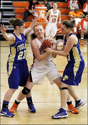 Findlay's Jacey Hardesty, left, and Abby Smarkel force a jump ball with Southview's Emily Westphal. The Trojans improved to 11-3. Southview is 11-5.