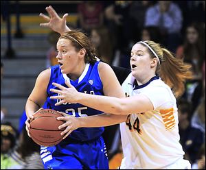 Toledo's Kyle Baumgartner defends Buffalo's Kristen Sharkey in the first half.   