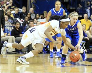 Toledo's Lucretia Smith, who had nine rebounds and six assists while scoring four points, steals the ball from Buffalo's Nicki Hopkins late in the second half of a Mid-American Conference game at Savage Arena.  