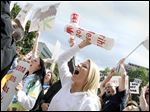  Michigan protesters shout during a rally to protest recent court rulings and proposed legislative changes that would make it harder for some licensed patients to get the drug. Though still outlawed at the federal level, medical marijuana has been legal for registered card holders in Colorado since 2000. The passage of Amendment 64 in November made it legal for adults in the state to possess up to an ounce of the substance, which could be available for purchase through licensed establishments as early as 2014.