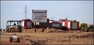 Rescue vehicles are parked at the natural gas plant near In Amenas, Algeria, where the hostage taking occurred. Algerian special forces made a final assault Saturday.