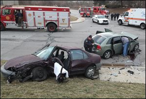 Toledo police and fire departments on the scene of a crash at Collingwood Blvd and Hamilton Street.