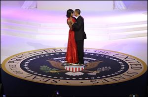 President Barack Obama and first lady Michelle Obama dance during the Commander-In-Chief Inaugural ball at the Washington Convention Center during the 57th Presidential Inauguration.