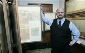 Andy Clark, new director of the Monroe County Historical Museum, in the map section, said he made it a point to start his position before the bicentennial celebrations of the Battles of the River Raisin.