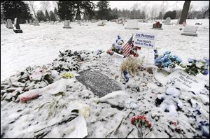 Snow covers the gravesite today of Joe Paterno in State College, Pa. 