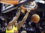  Tristan Thompson dunks for two of his 21 points against the Celtics. Kyrie Irving scored 40 points as Cleveland won.