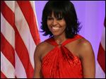  First lady Michelle Obama as she arrives at the Inaugural Ball in Washington on Jan. 21, 2009, left, and Jan. 21, 2013, right. Mrs. Obama made it a fashion tradition Monday night, wearing a custom-made Jason Wu gown to the inaugural balls. 