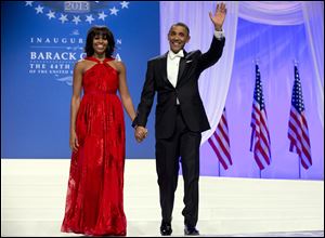 President Obama and first lady Michelle Obama arrive to dance together at an Inaugural Ball Monday night.