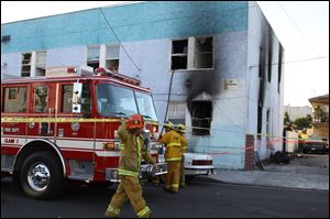 Fire roared through the Palos Verdes Inn, a 90-year-old residential hotel in the harbor area, early today, injuring 14 people, three of them critically, in San Pedro, Calif.