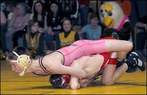Clay's Jared Davis controls Central Catholic's Josh Venia at 113 pounds. Davis, a junior, has a 23-5 record this season.