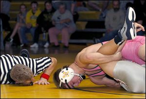 Clay's Nick Stencel works for a fall against Central Catholic's Colin Kaucher. Stencel, a senior, is 27-7 in the 160-pound division.