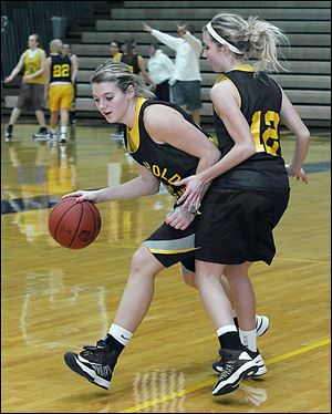 Cassidy Wyse dribbles against Taylor Coressel in practice. Wyse, a 5-foot-9 junior, leads the Blue Streaks in scoring (14.4), rebounding (6.6), assists (2.9) and steals (5.7).