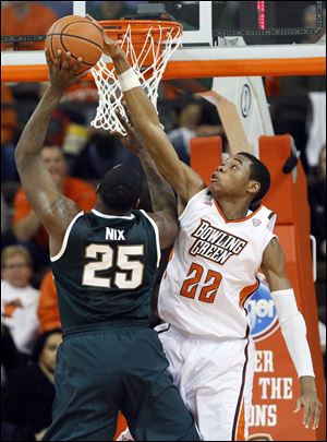 Bowling Green State University forward Richaun Holmes (22) shares similar numbers with fellow big man Cameron Black, including their minutes per game as Black averages 19.8 and Holmes 18.3. Holmes averages 5.3 points and 4.8 rebounds per game, while Black contributes 3.4 points and 3.8 rebounds.