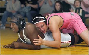 Clay's Eddie Silva, right, controls Central Catholic's Chris Norwood. Silva, a 195-pound senior, is 25-5 this season.