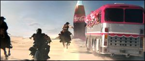 This frame grab provided by Coca Cola shows a moment in the Super Bowl 2013 Coca Cola campaign. The campaign, which will include TV spots as well as a Web site and interaction with consumers on social media sites like Twitter and Instagram, is the beverage maker’s latest attempt to capture the interest of people who watch the Big Game with a second screen such as a tablet or smart phone nearby.