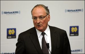 Notre Dame Athletic Director Jack Swarbrick speaks to reporters earlier this month during a news conference regarding a hoax involving linebacker Manti Te'o.